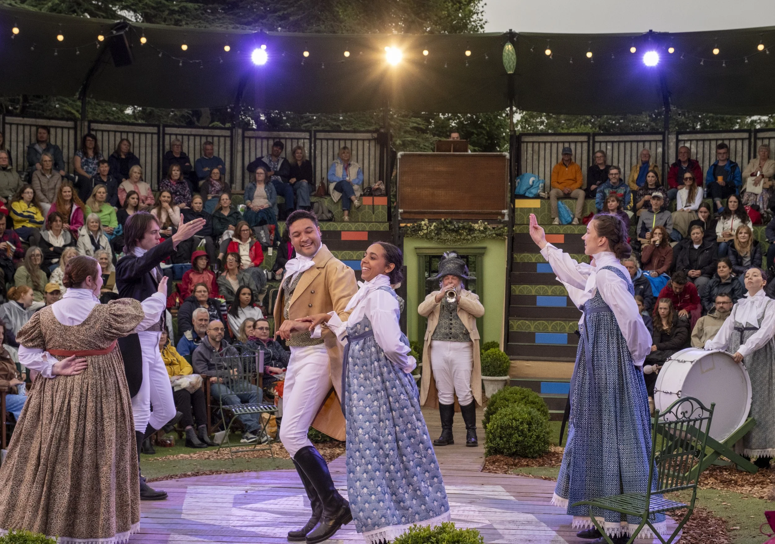 Actors perform Pride and Prejudice at Grosvenor Park Open Air Theatre to an audience sitting in the round
