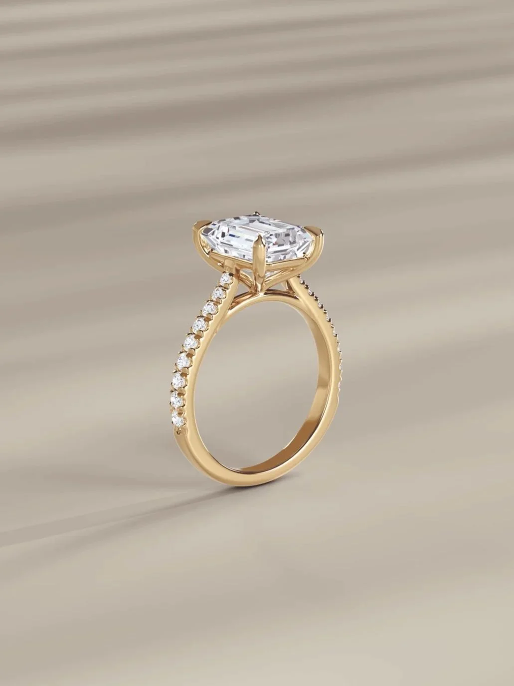 A gold ring with a large, oval-cut diamond center stone and smaller diamonds set along the band.