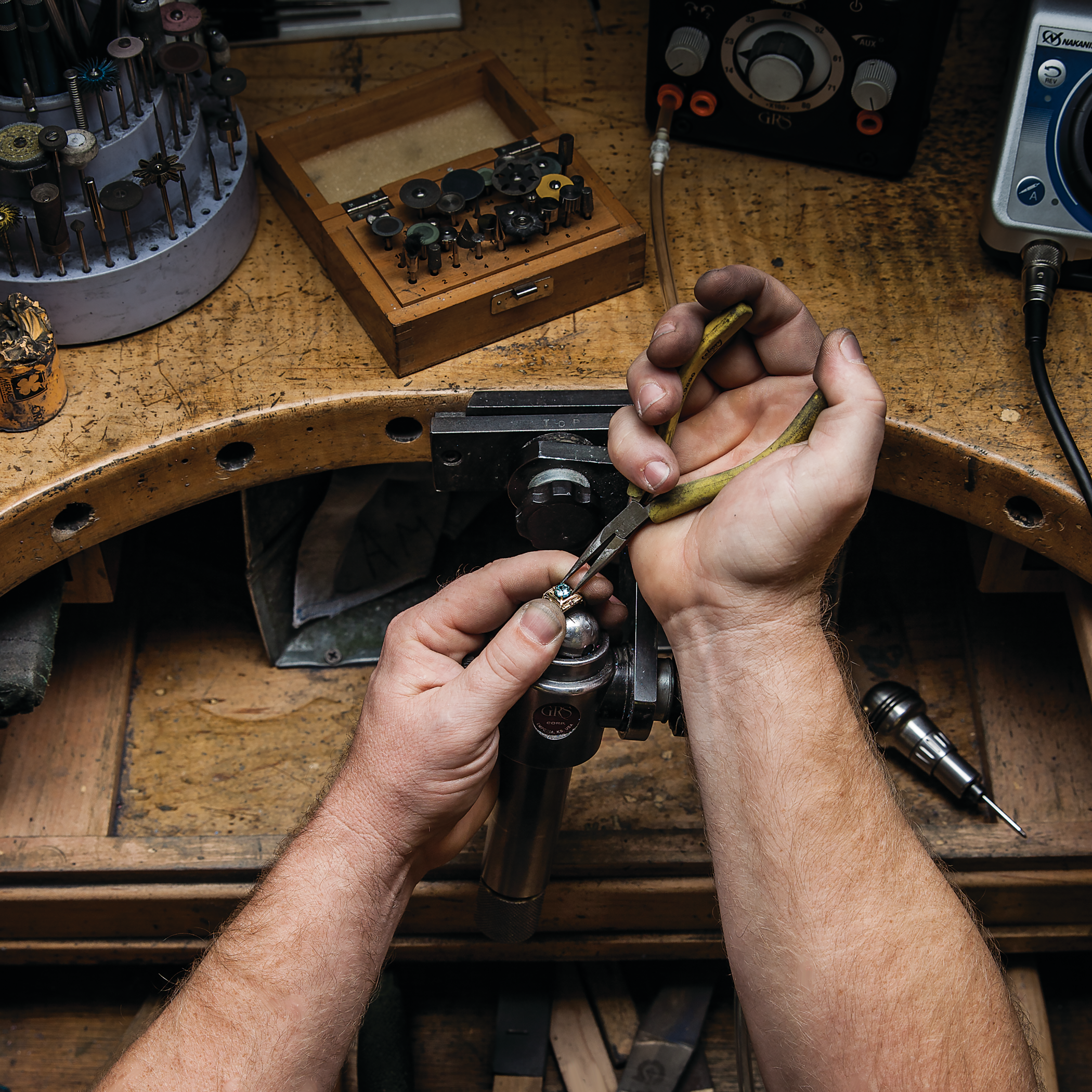 Hands of a goldsmith at his bench in Bluffton, South Carolina.