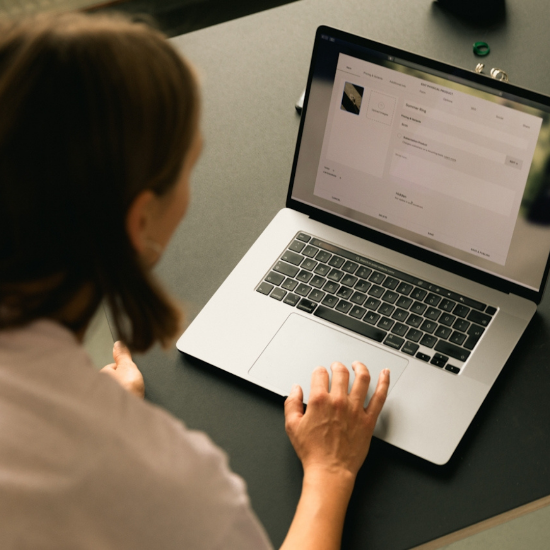 Person reviewing structured blog content on a laptop, illustrating how SEO blogging is adapted for AI search and answer engine optimization
