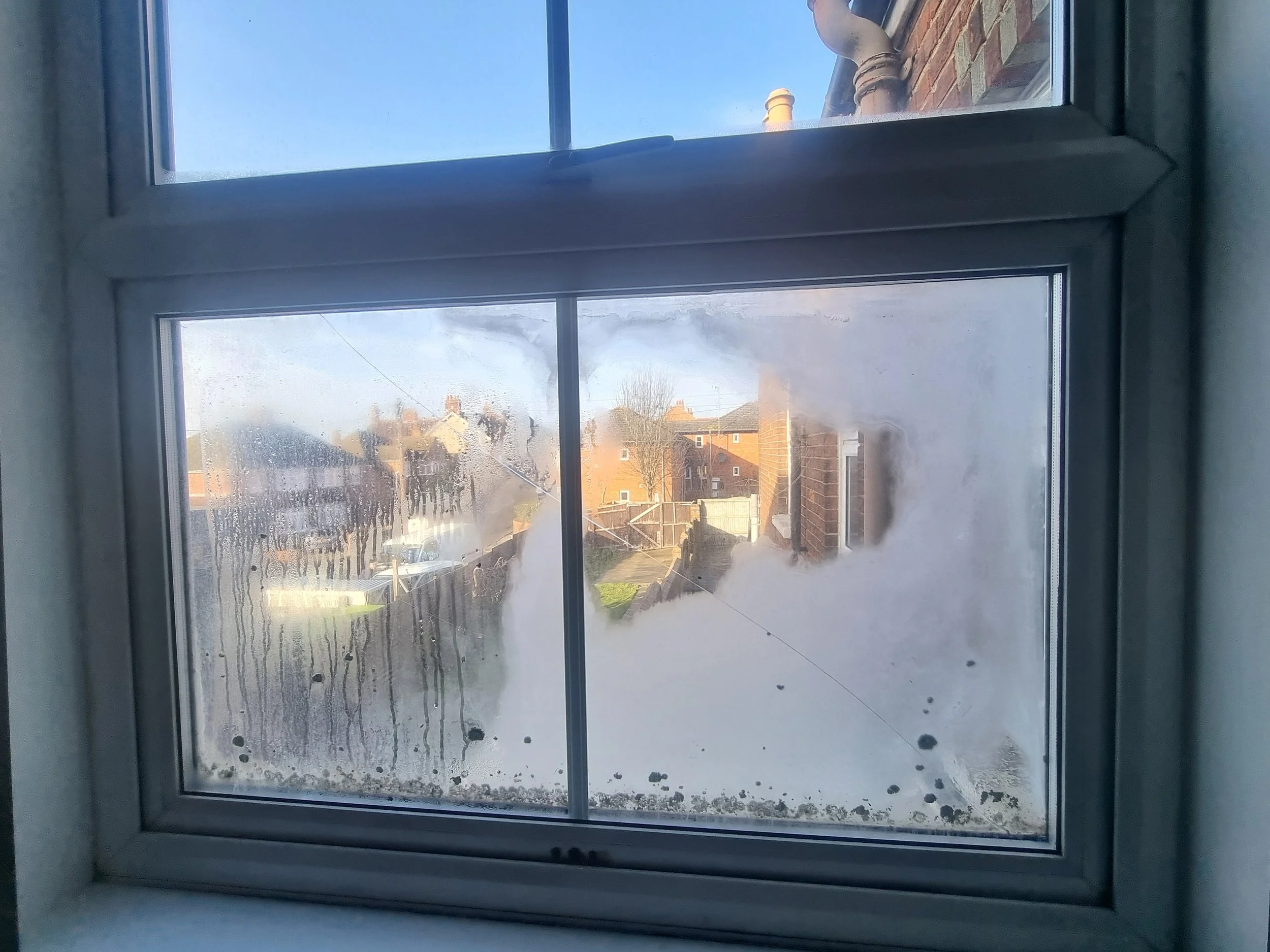 misted double glaze unit in a white upvc window