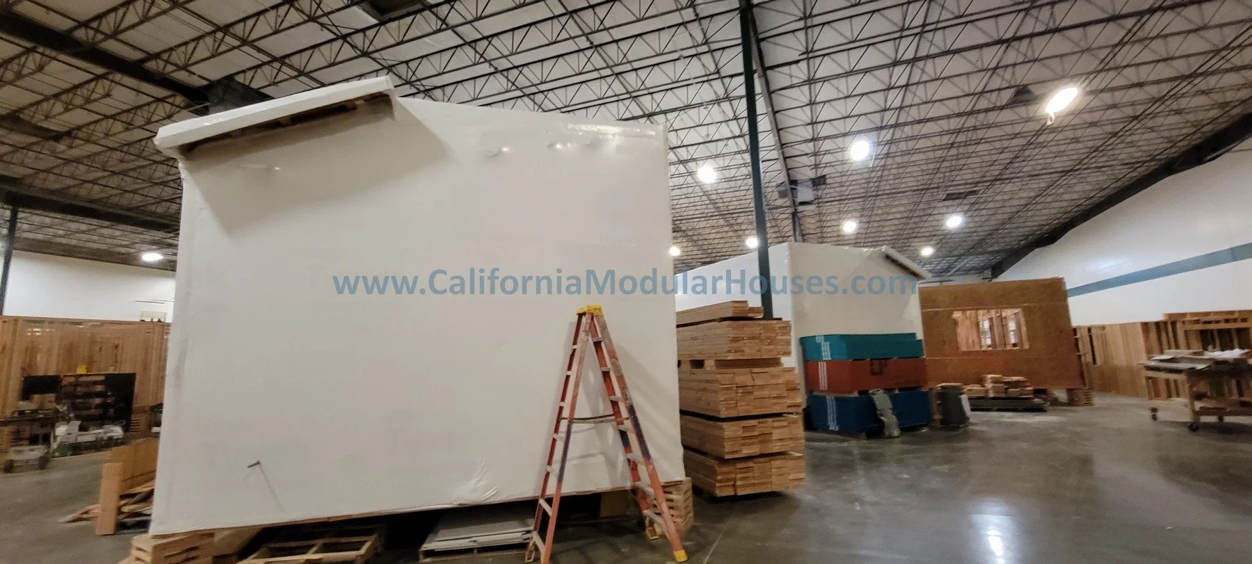 Prefab Modular Home.  Ready to ship.  Siding installed.  House wrapped for shipping.  California prefab.  CA modular.  