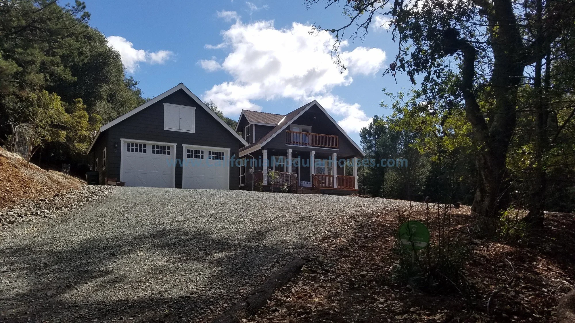 Here is a picture of the garage that was site built with the beautifully completed home sitting right behind it bringing our client's dream home to life in the California South Bay.  