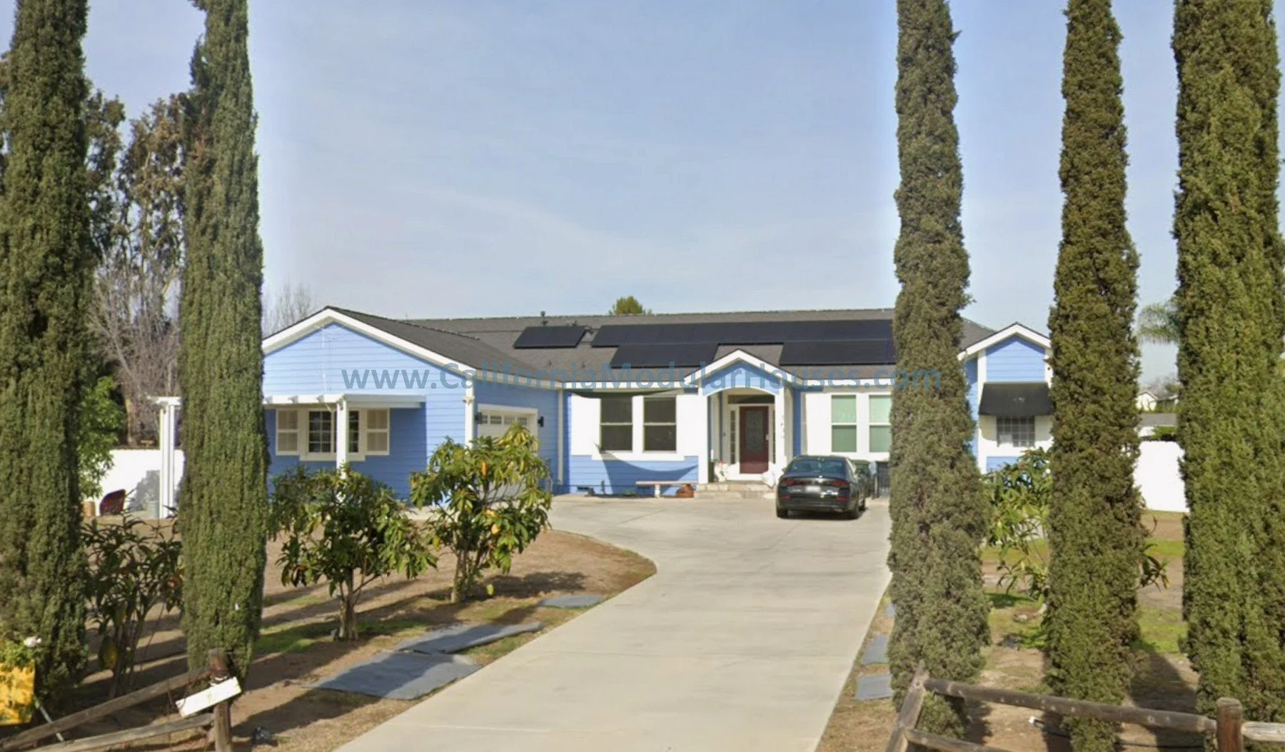 Prefab modular home, blue siding, white trim, gray roof built in Poway, San Diego County, CA.