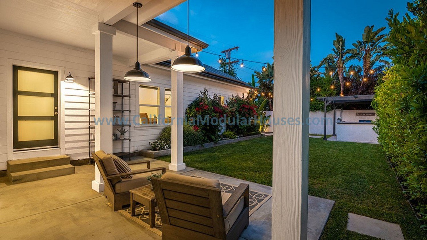 Imagine sitting under this site built covered porch behind the garage and enjoying that beautiful sky view with palm trees in the background.  L.A. CA.  Palm Trees.  Factory Built Housing.  