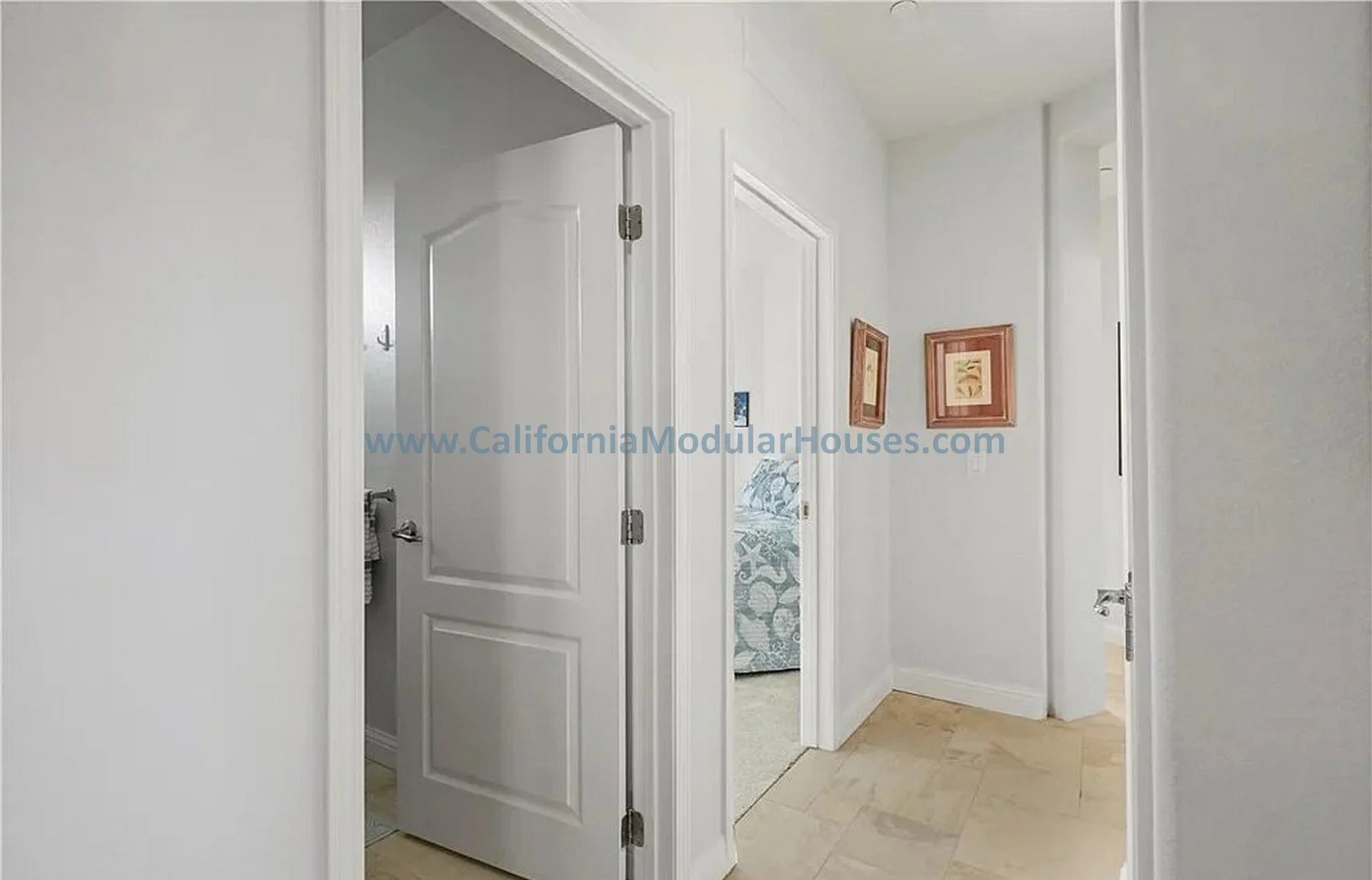 Hallway with white walls and doors.  California Modular Houses. Modular home construction California.  Prefab house.  Oxnard, Ventura County, CA.   