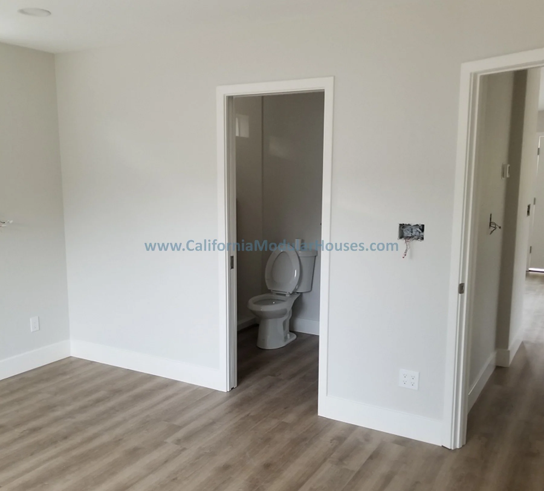 Empty room with unfinished bathroom and outlet on wall.  Modular granny flat.  California.   Contra Costa County, CA 
