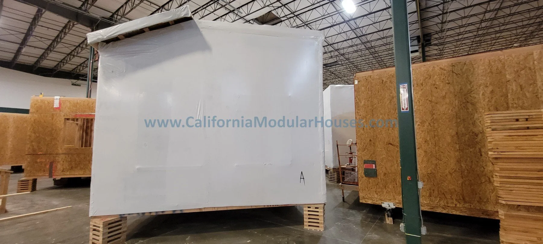 Prefab Modular Home.  Ready to ship.  Siding installed.  House wrapped for shipping.  California prefab.  CA modular.  