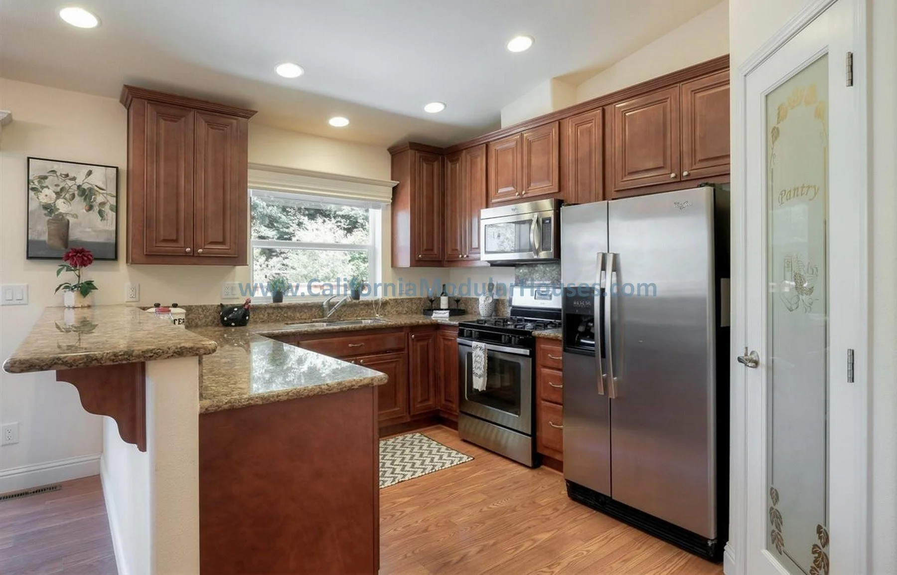 The Teal Interior.  Modulars for Martinez, Contra Costa County, CA.  Pre-fabricated homes.  Prefab ADU models.  California prefab ADU. Modular.  Prefab Accessory Dwelling Unit.  Kitchen with hardtop Countertops.  Modular ADU.  Modular Homes. 