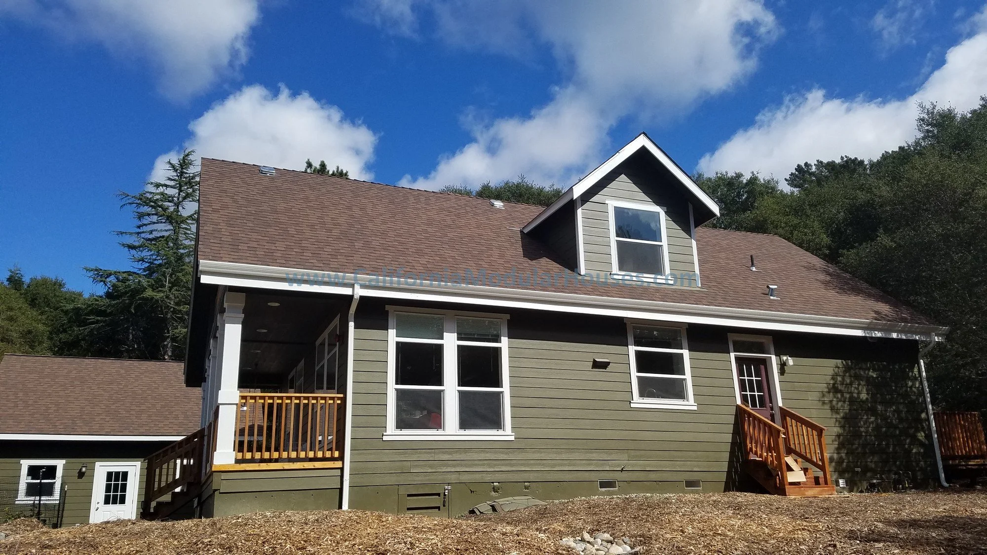 The dormers on this Cape Cod home let light into the rooms, making it beautiful inside and out.   Factory Built Housing for California.  