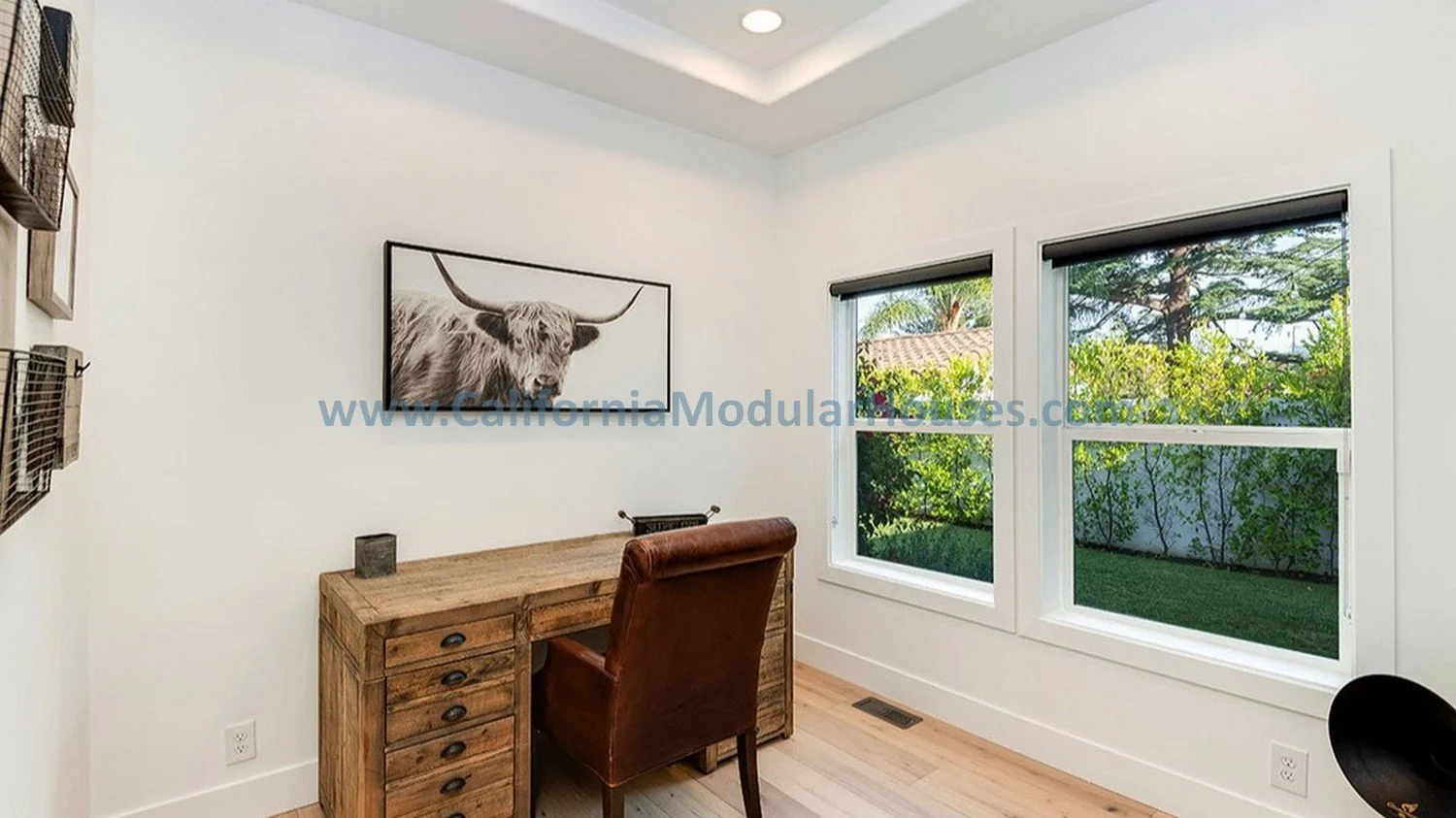 This is one of the bedrooms in this Factory Built Home with nice wide windows both for lots of natural lighting and for egress.  The windows feature a nice bold frame, as does the moulding over the site completed flooring.   