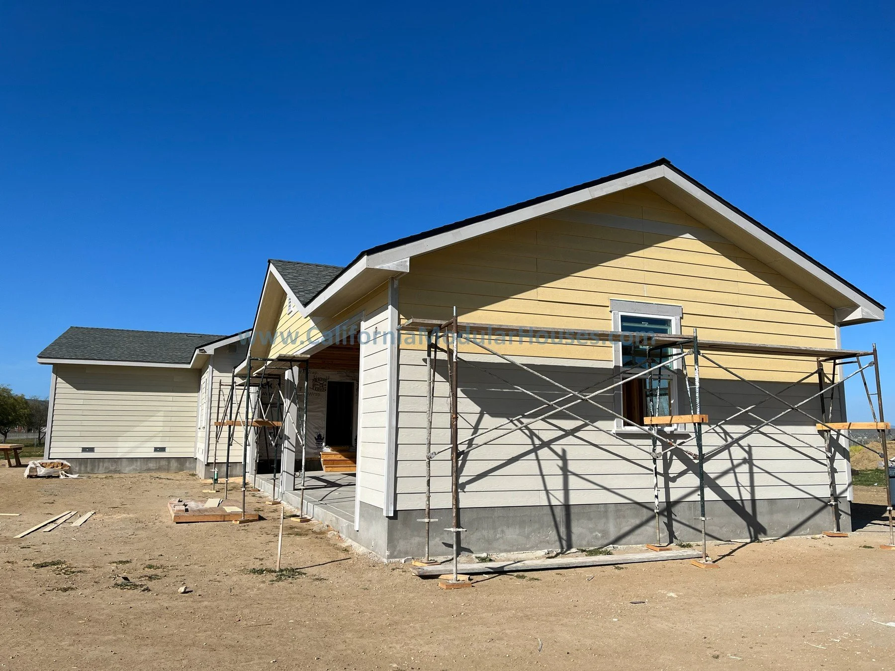 California modular home.  Progress image 4 of site built 3 car garage attached to a modular house.  San Juan Bautista, CA.  