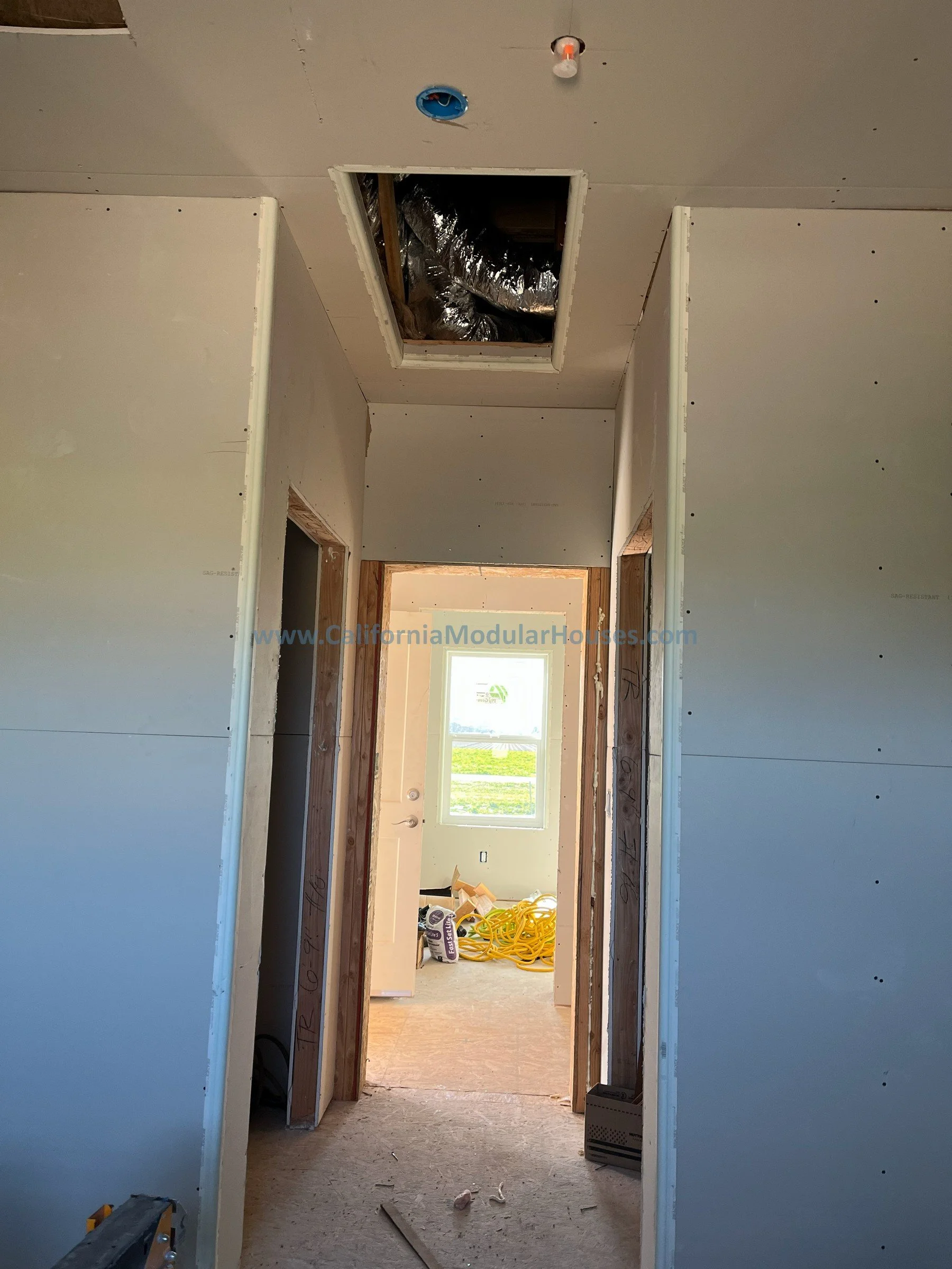 Interior progress picture of the hallway of a Factory Built Home for San Juan Bautista, CA. California Modular Houses, Inc. California Modular.  Prefab modular.  Modular Home CA.  