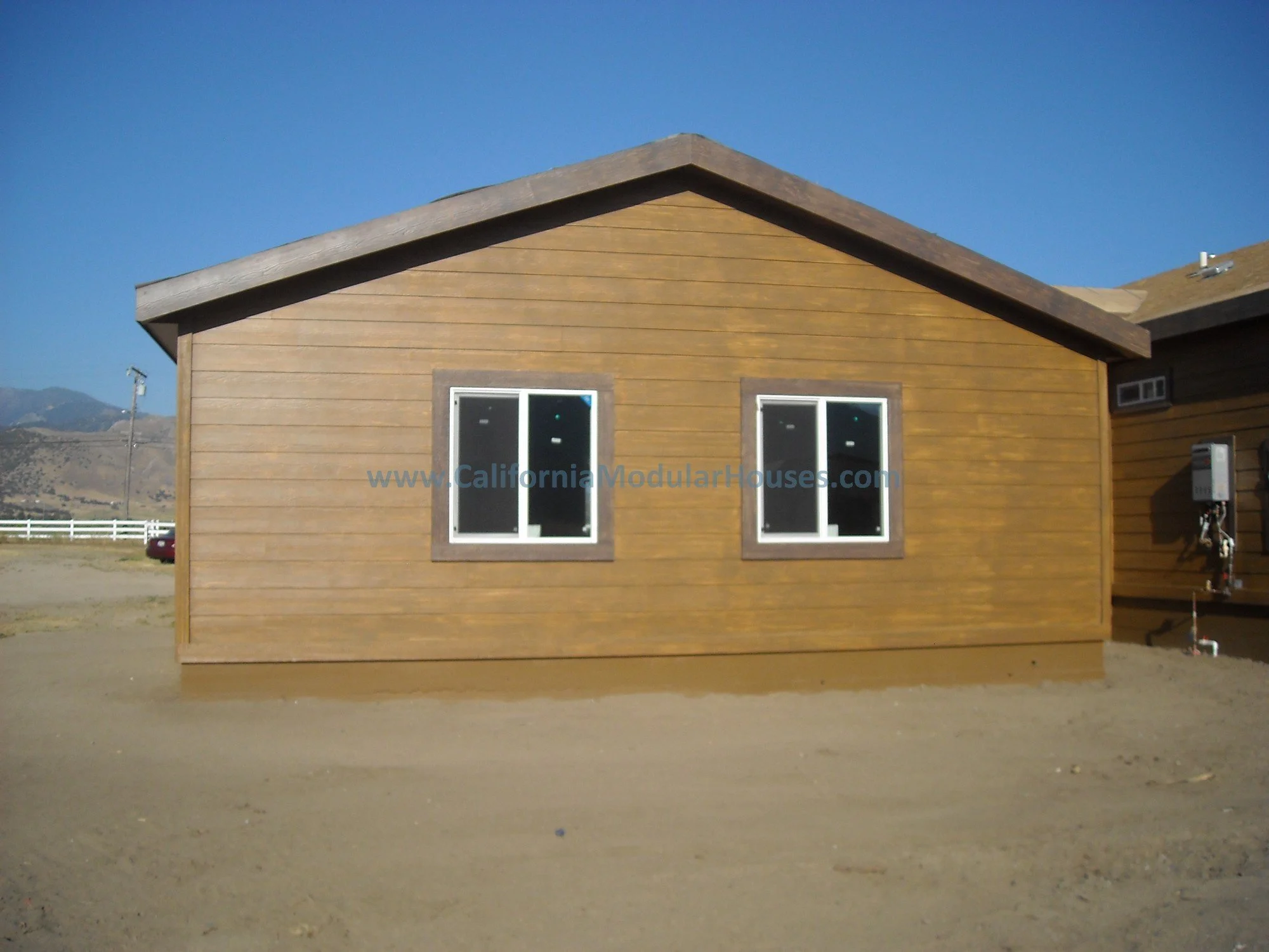 This is the site built garage, built on a slab, with a different perspective.  The windows were shipped loose to match the windows in the modular home.  