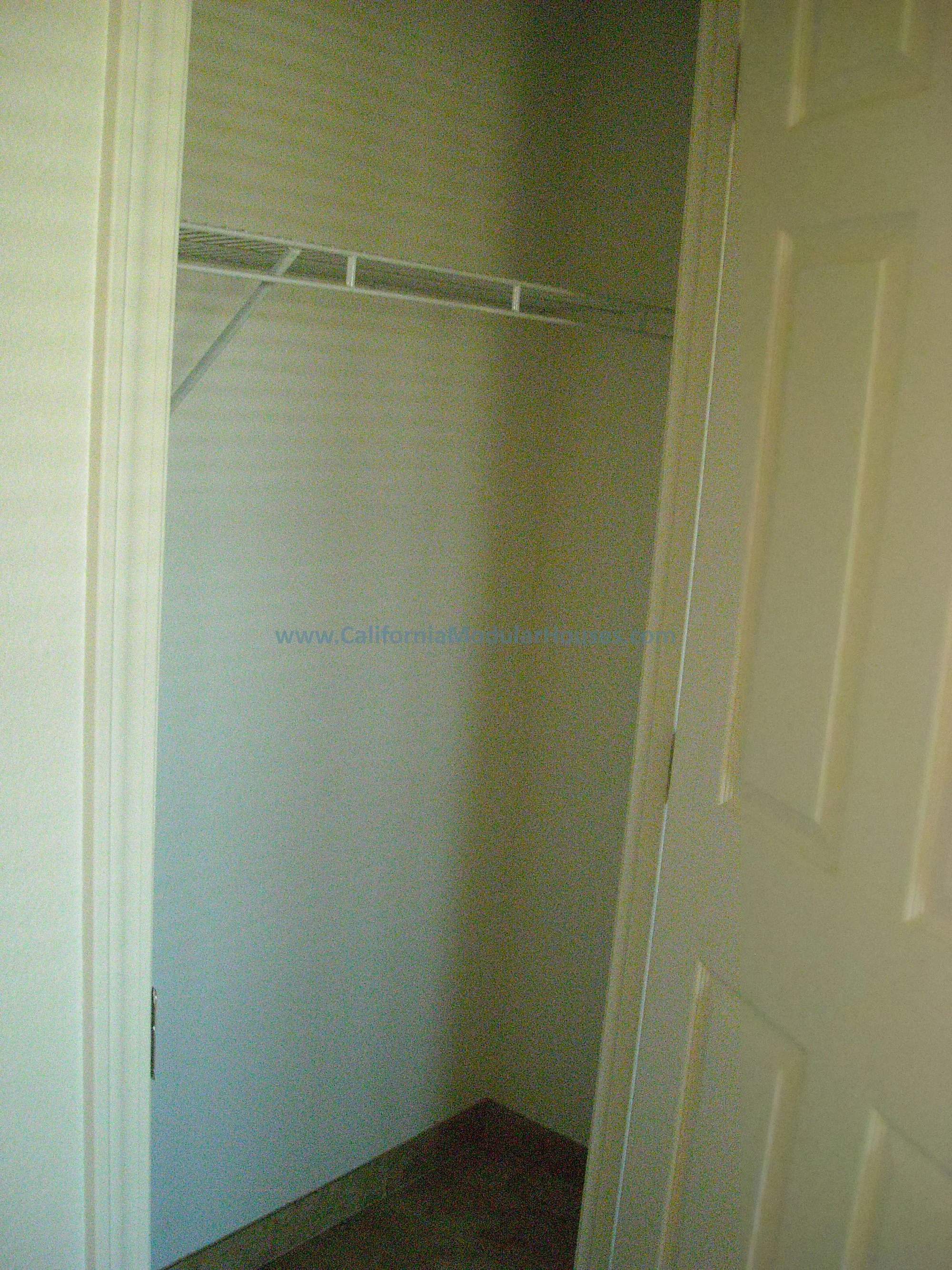 A large walk in closet in this modular home for Kern County, CA.  