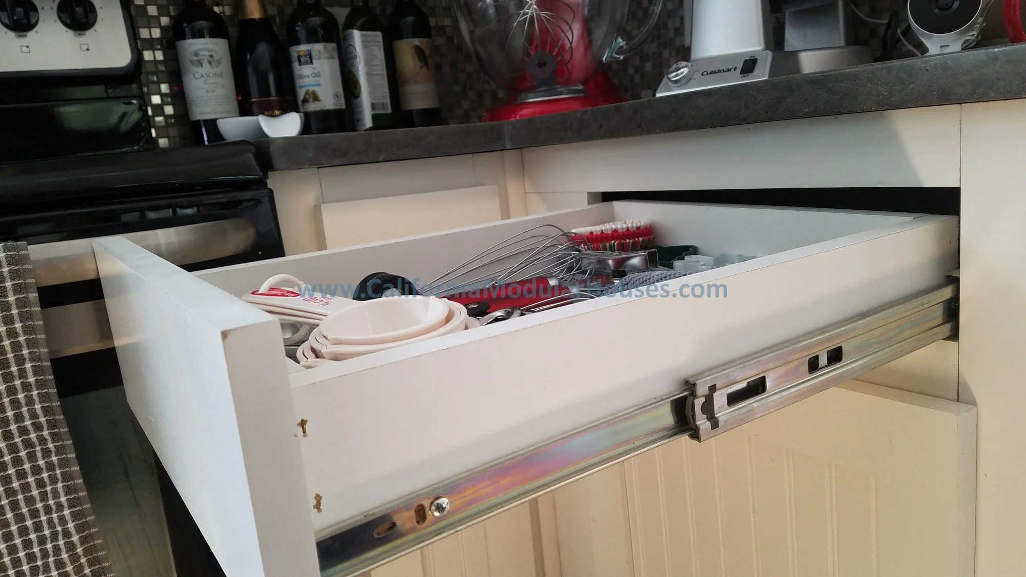 This image shows the quality of the drawers with full extensions, wood cabinets, drawers, and face frames.  There are nice hardtop counters in the kitchen as well.  