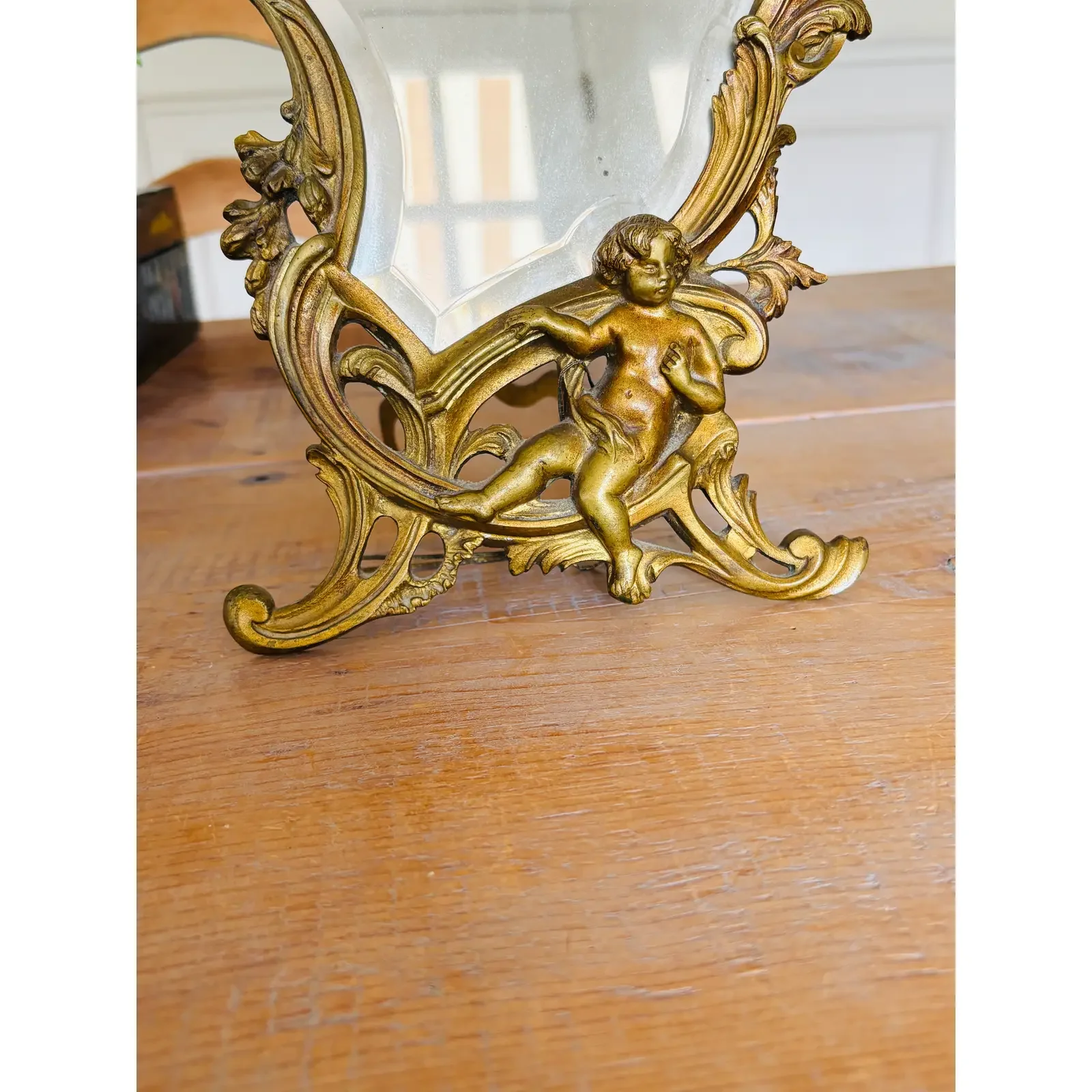 antique-french-rococo-gilt-bronze-vanity-mirror-with-cherubs-9544.webp