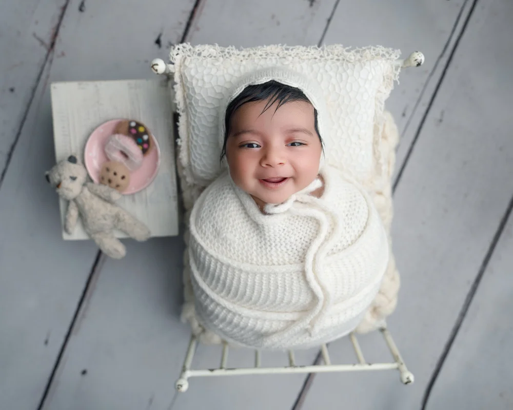 Smiling awake newborn photography Auckland