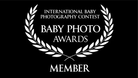 Certificate or award with text, laurel branches, and a black background for the International Baby Photography Contest Baby Photo Awards Member.