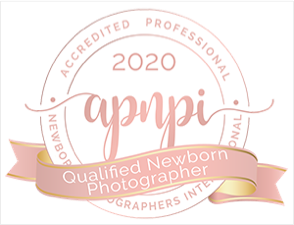APNPI 2020 Certified Newborn Photographer badge with a pink ribbon and gold accents.