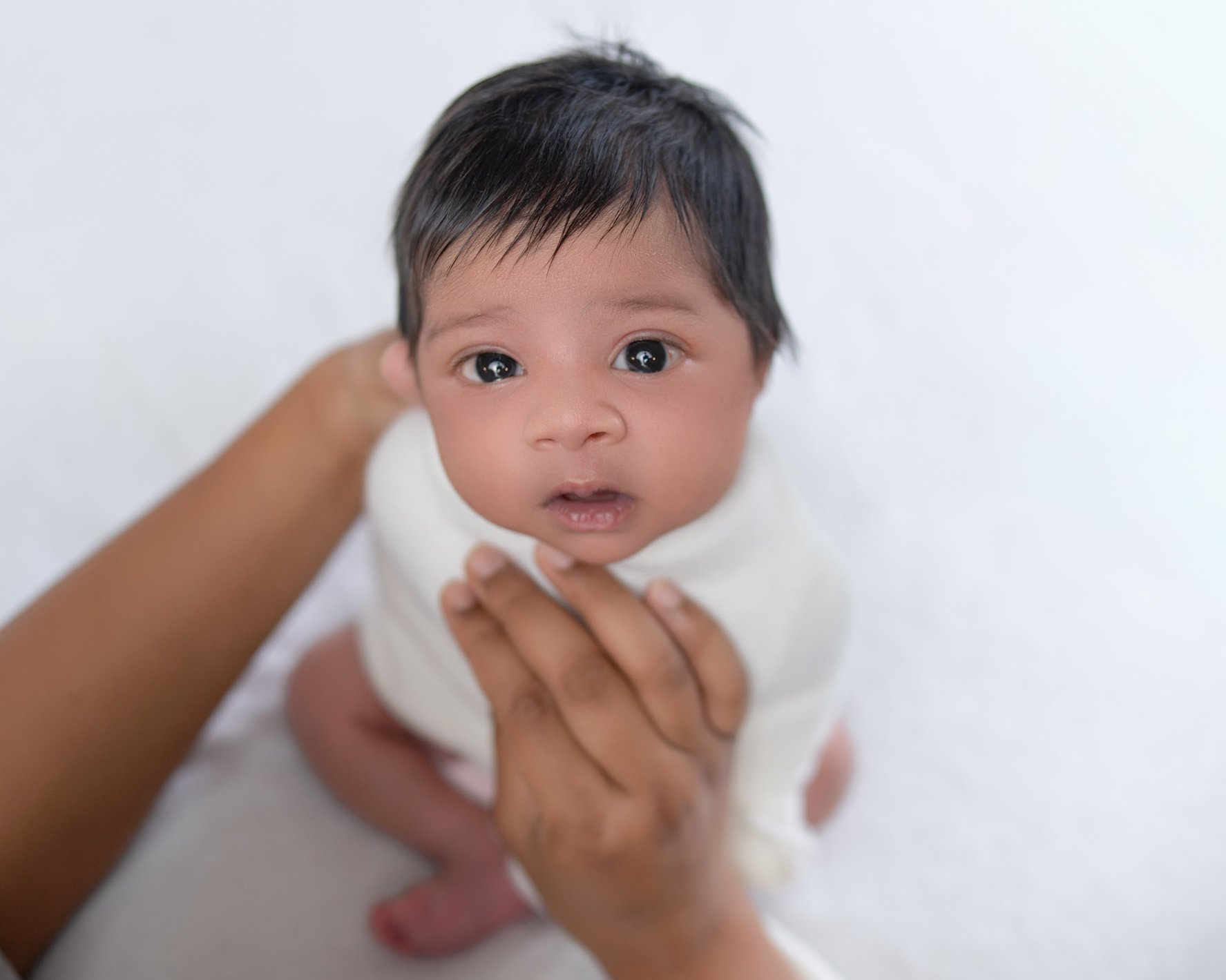 An awake baby during his newborn session in Auckland