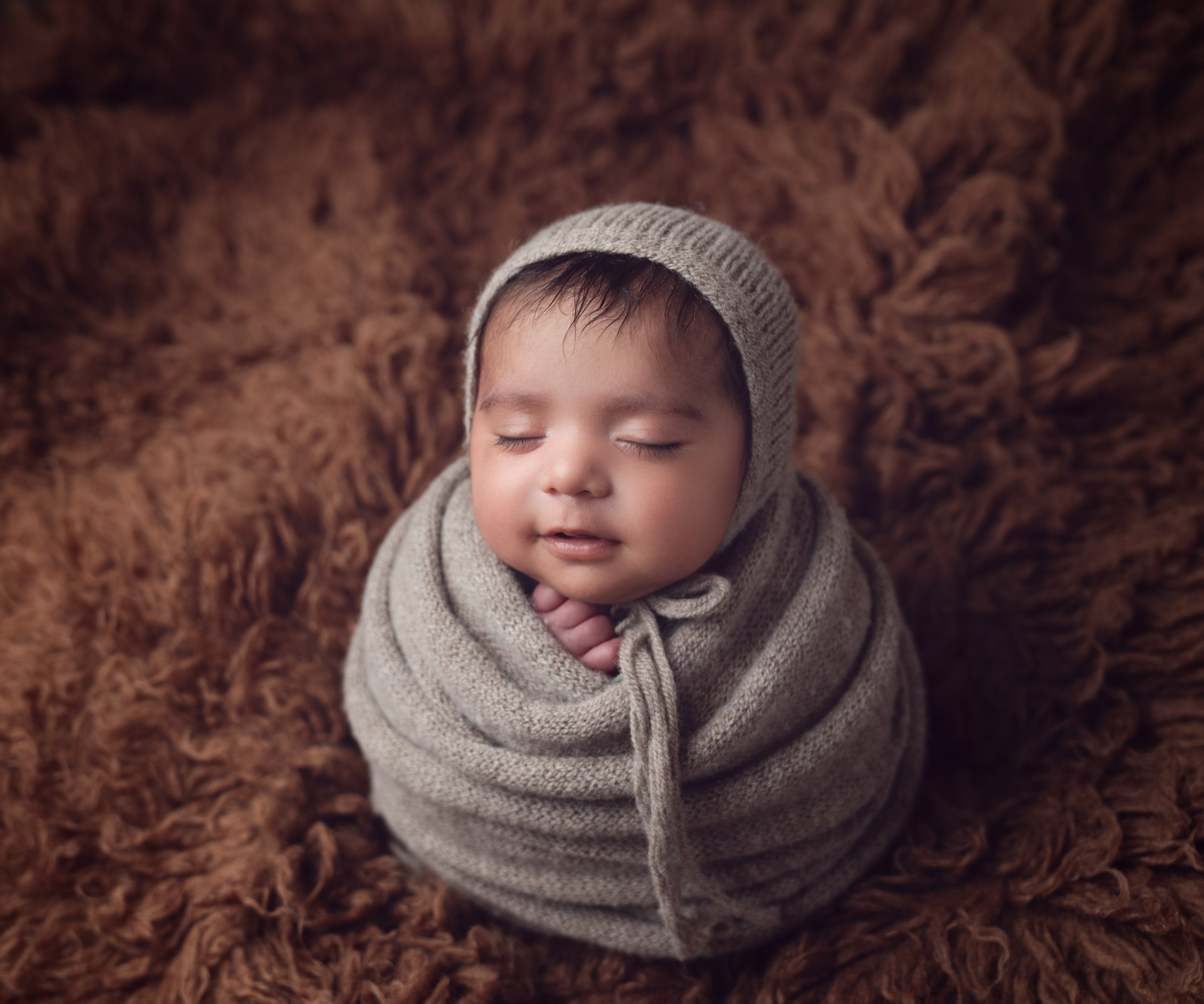 Newborn baby wrapped session in Auckland studio by Racheal Trail Photography