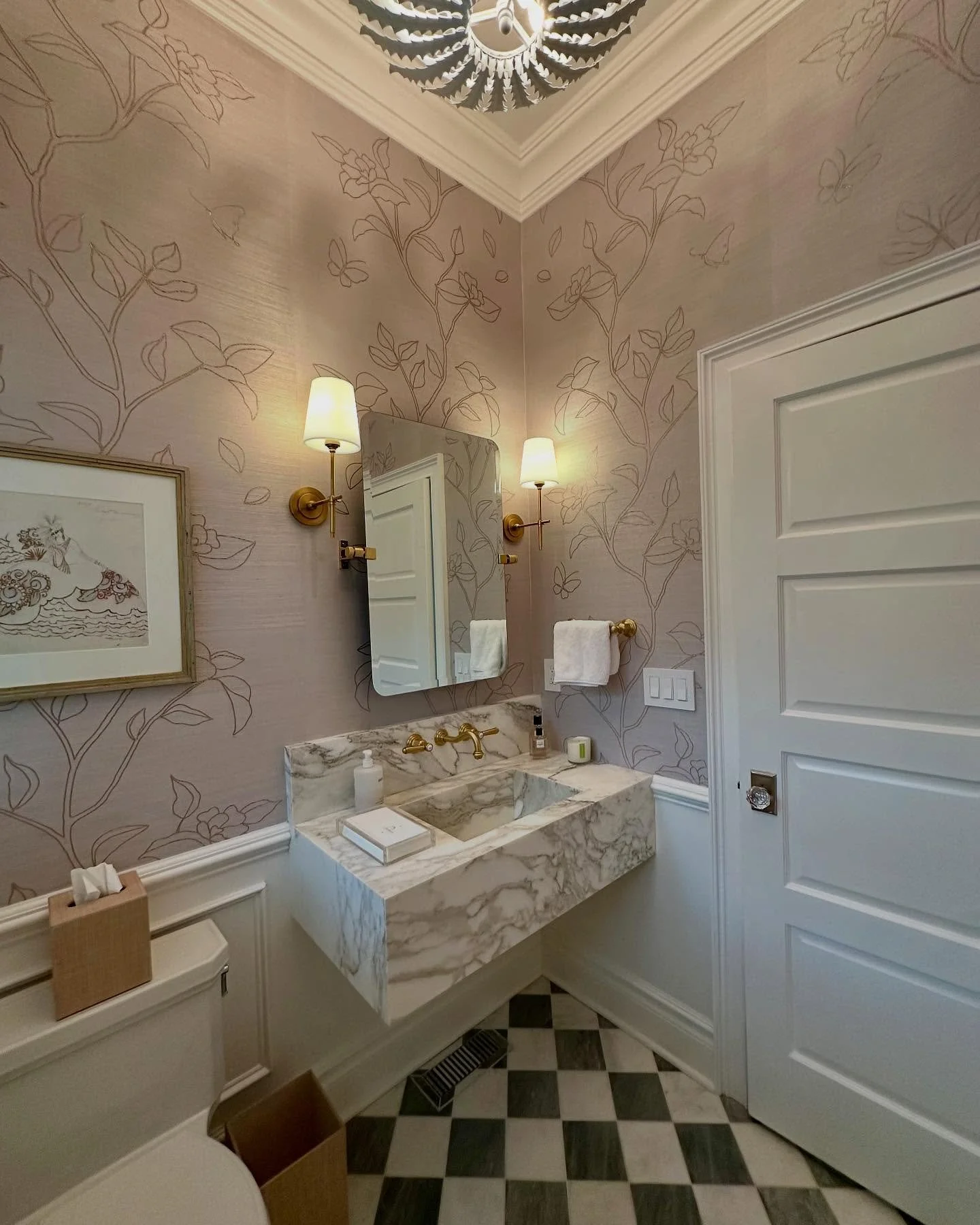 Partnered with our client to design this Powder Room. Custom marble mitered floating sink, checkerboard marble floors, timeless wallpaper &amp; beautiful finishes complete the space 😍