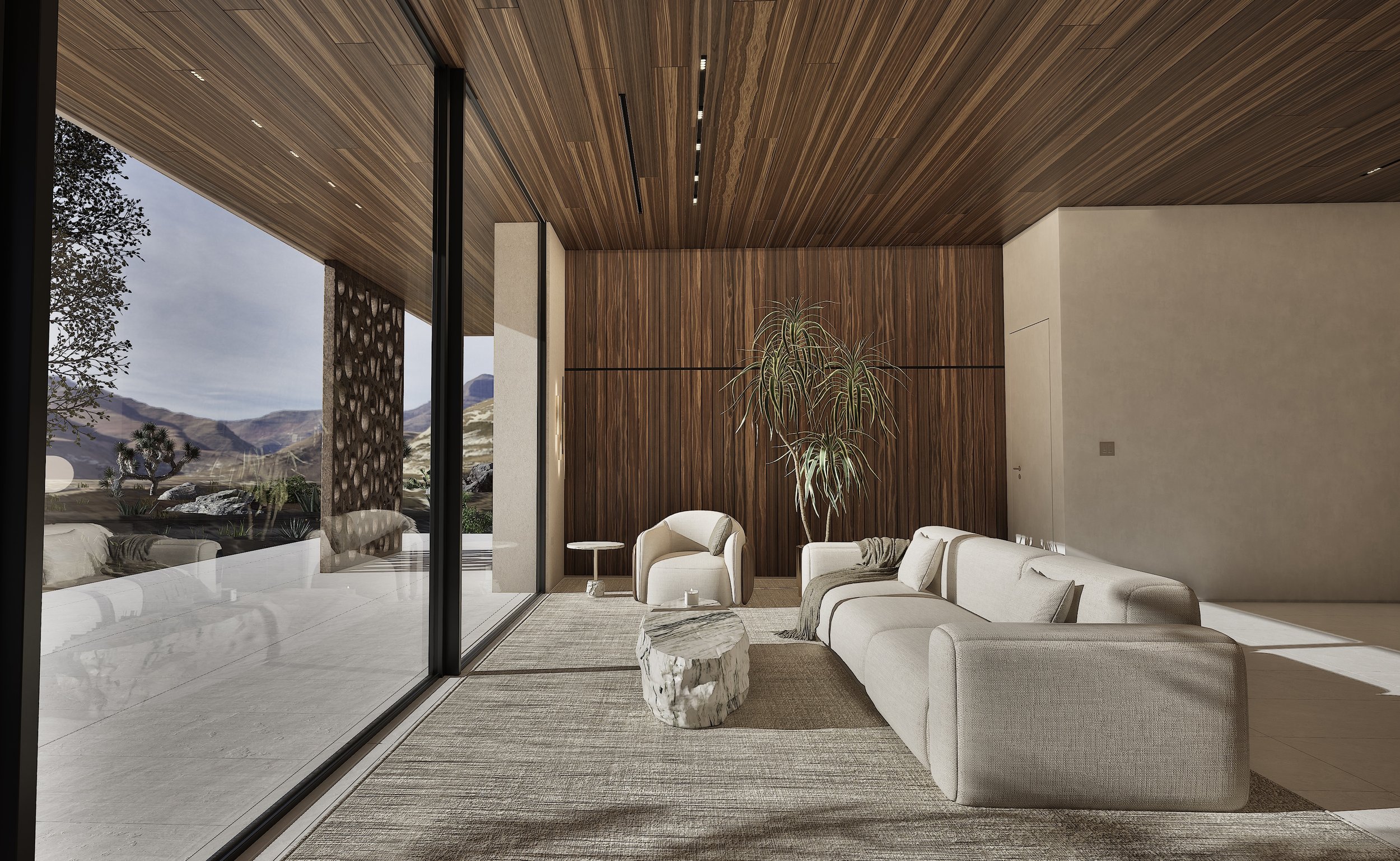 Living room at Shadow Wash Pavilion featuring floor-to-ceiling glazing, warm wood ceilings, limestone flooring, natural materials, and panoramic Mojave Desert views.