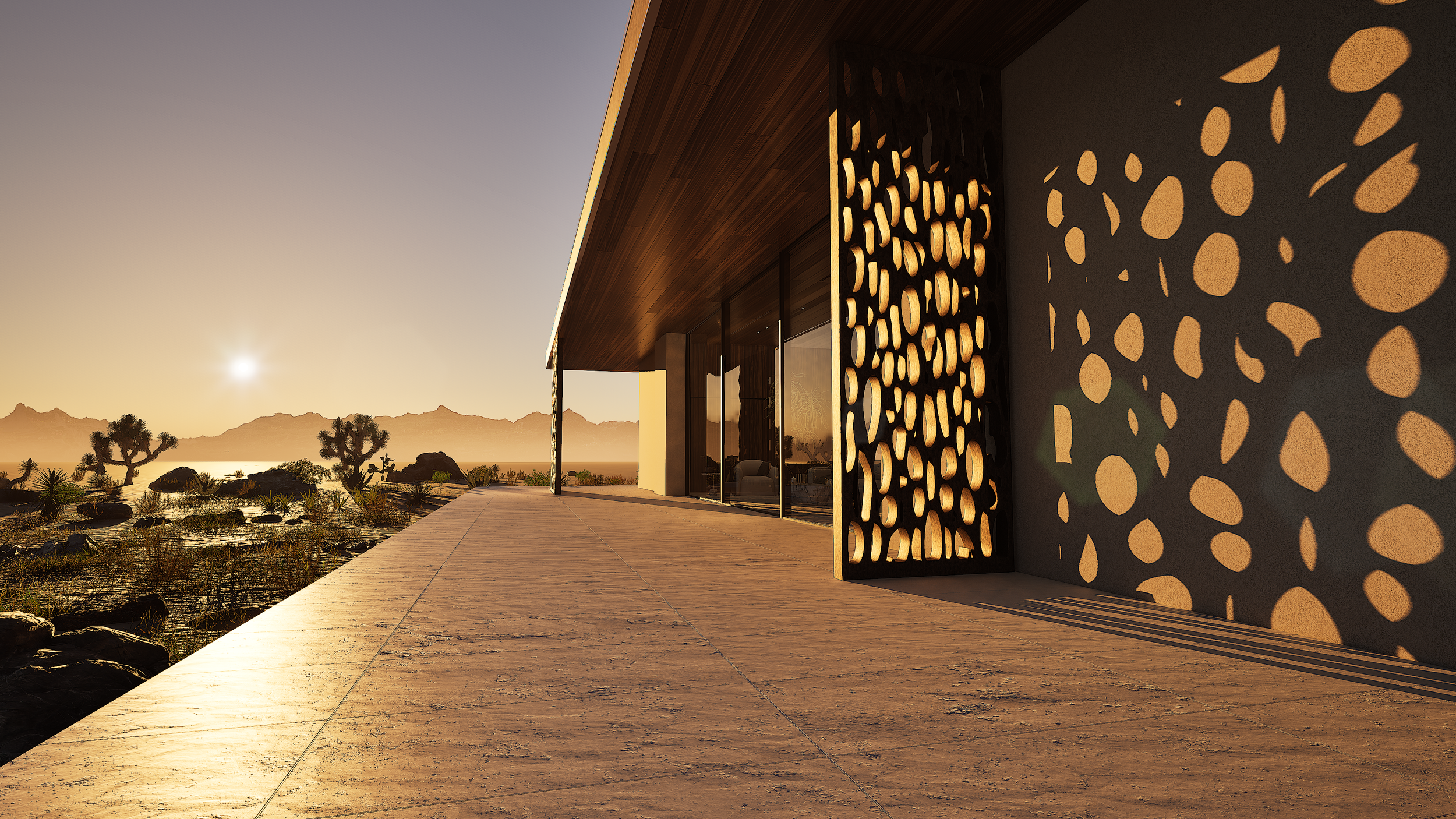 Exterior detail of Shadow Wash Pavilion by Mystic Sand in Twentynine Palms, California, featuring sculptural perforated privacy screens, deep roof overhangs, floor-to-ceiling glazing, and warm sunset light across the Mojave Desert.
