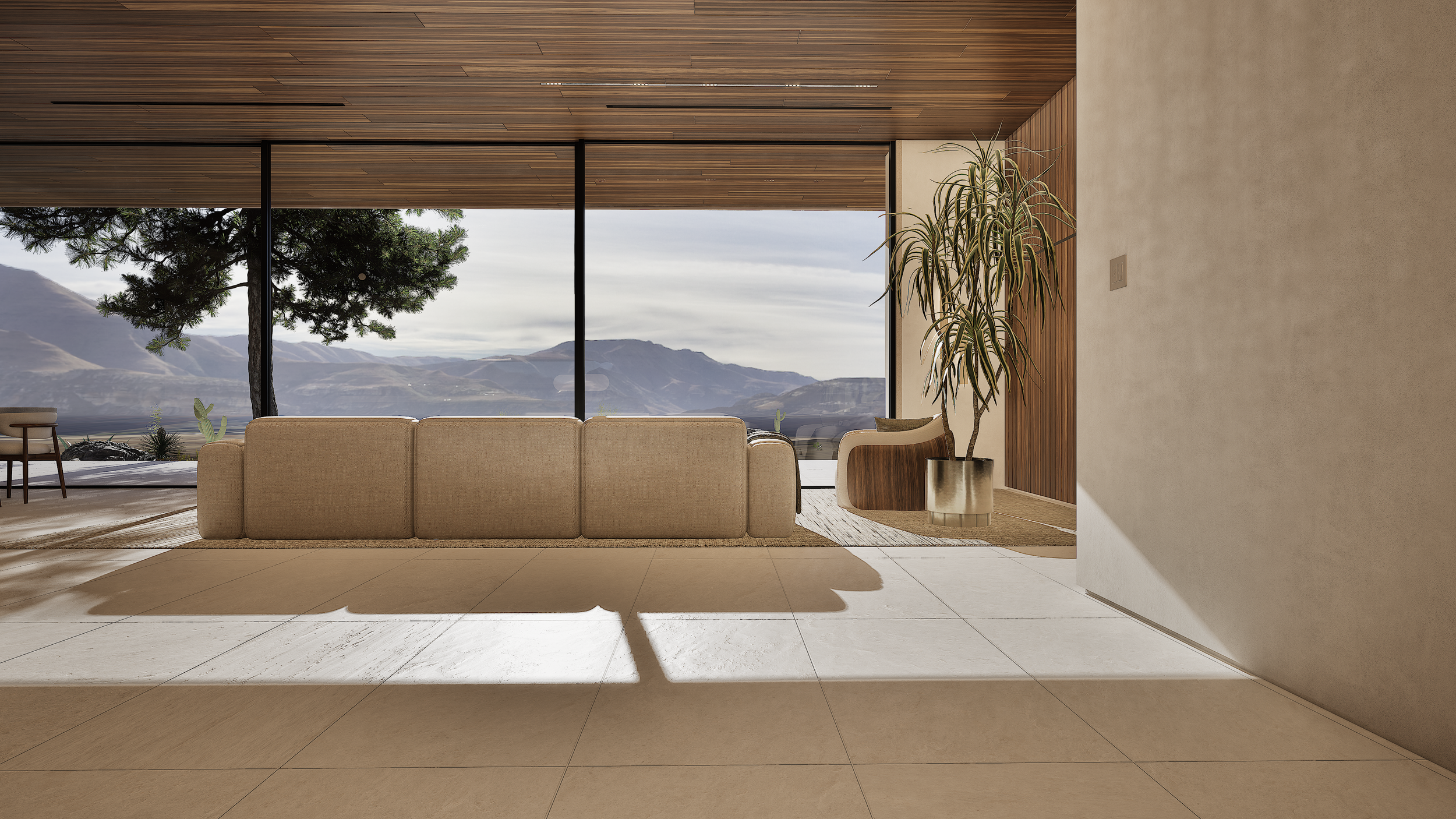 Living room at Shadow Wash Pavilion by Mystic Sand featuring floor-to-ceiling glazing, natural limestone flooring, warm wood ceilings, and panoramic Mojave Desert mountain views.