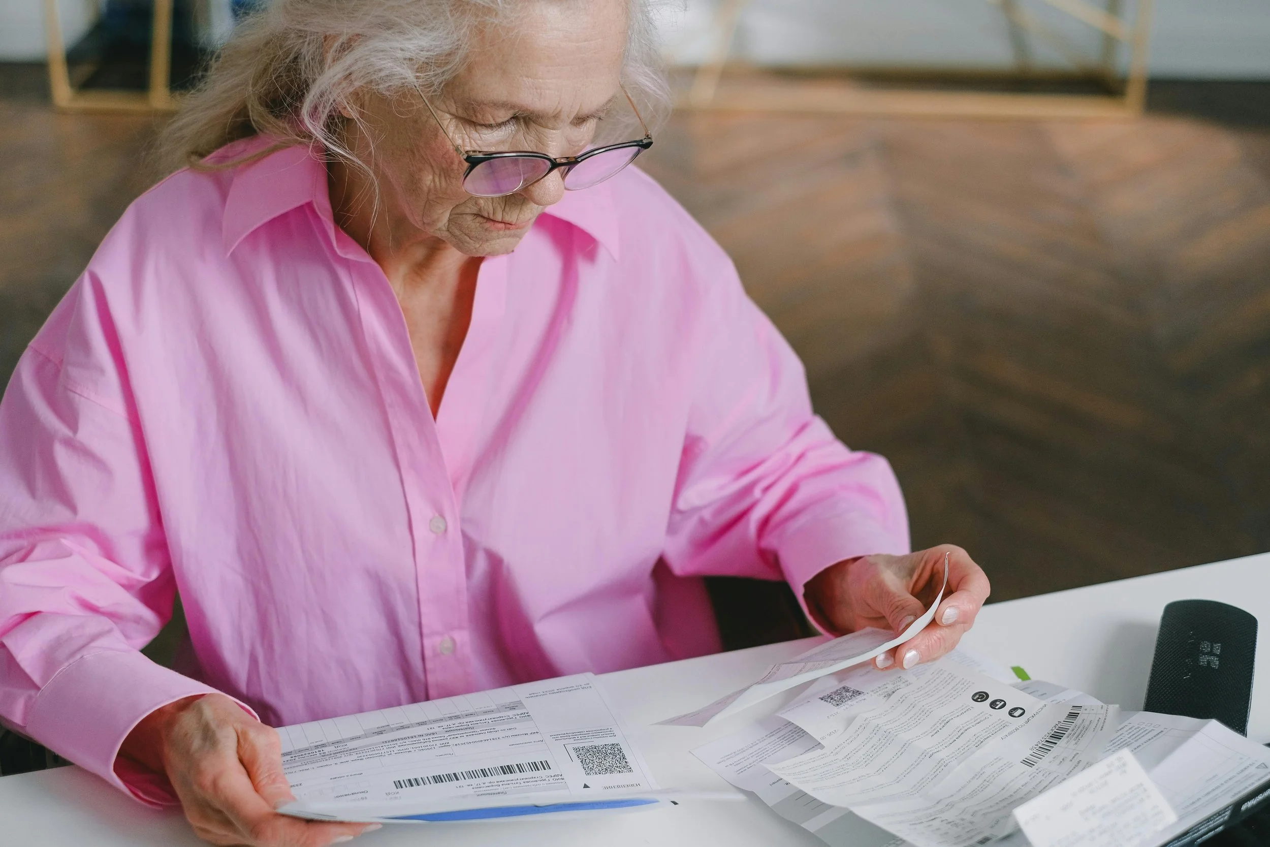 An older woman trying to figure out her Medicare options, following the recent moratorium on enrollments.