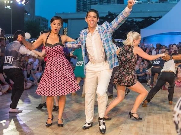 People swing dancing together