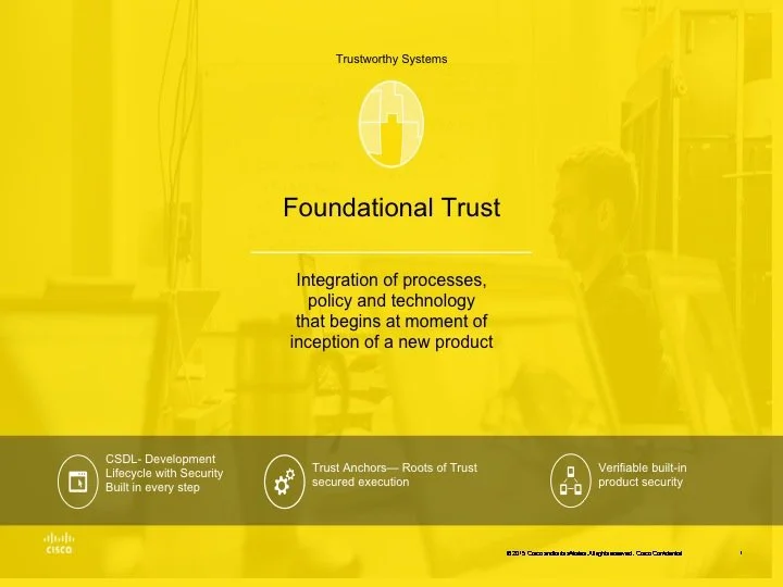 A presentation slide titled 'Foundational Trust' with a yellow background, featuring a logo at the top, and text about integrating processes, policy, and technology from inception of a new product. The slide includes icons and descriptions related to security and trusted execution, with a faint image of a person and equipment in the background.