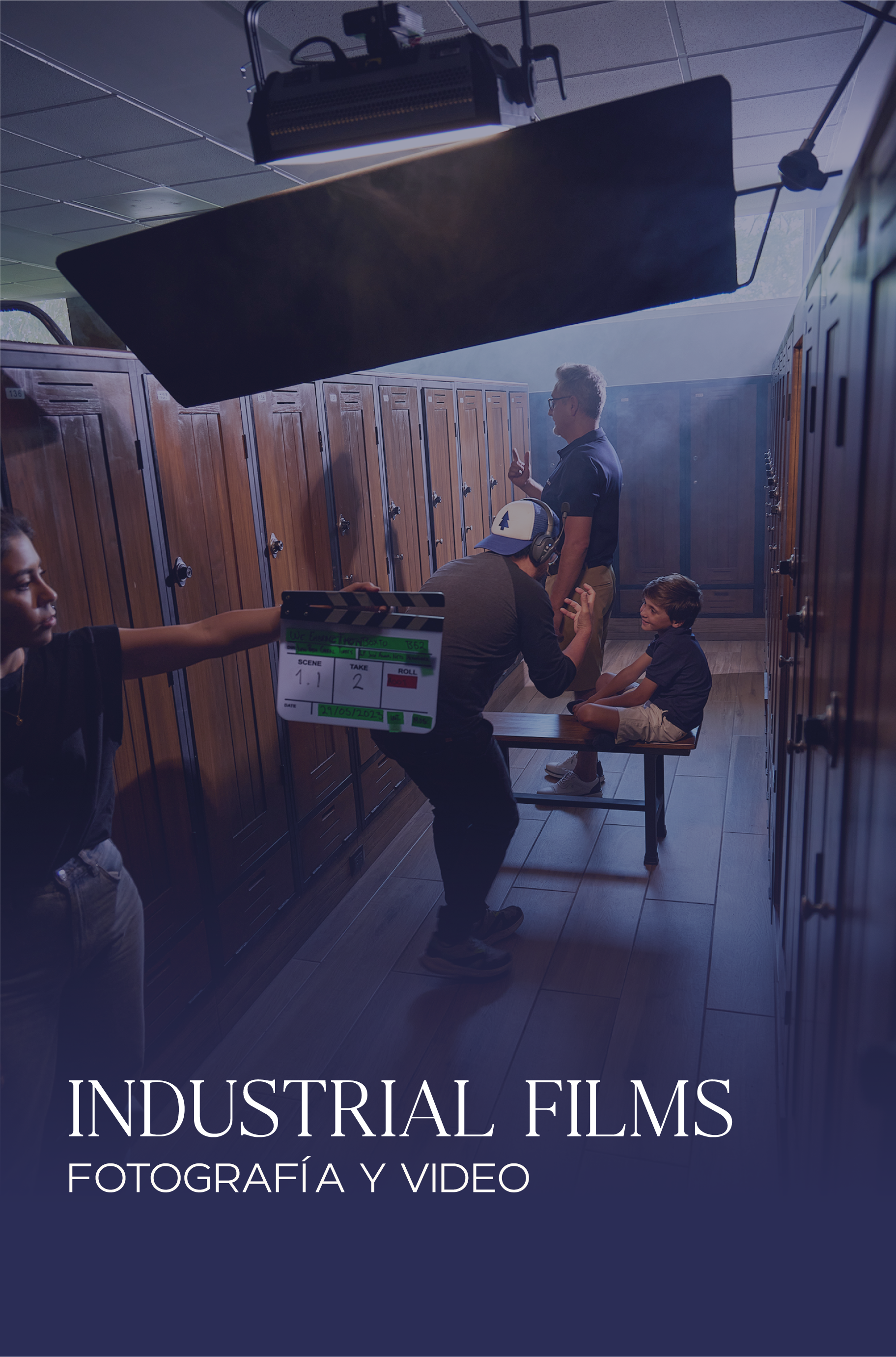 Filmmaking scene with crew filming a boy sitting on a bench in a gym locker room