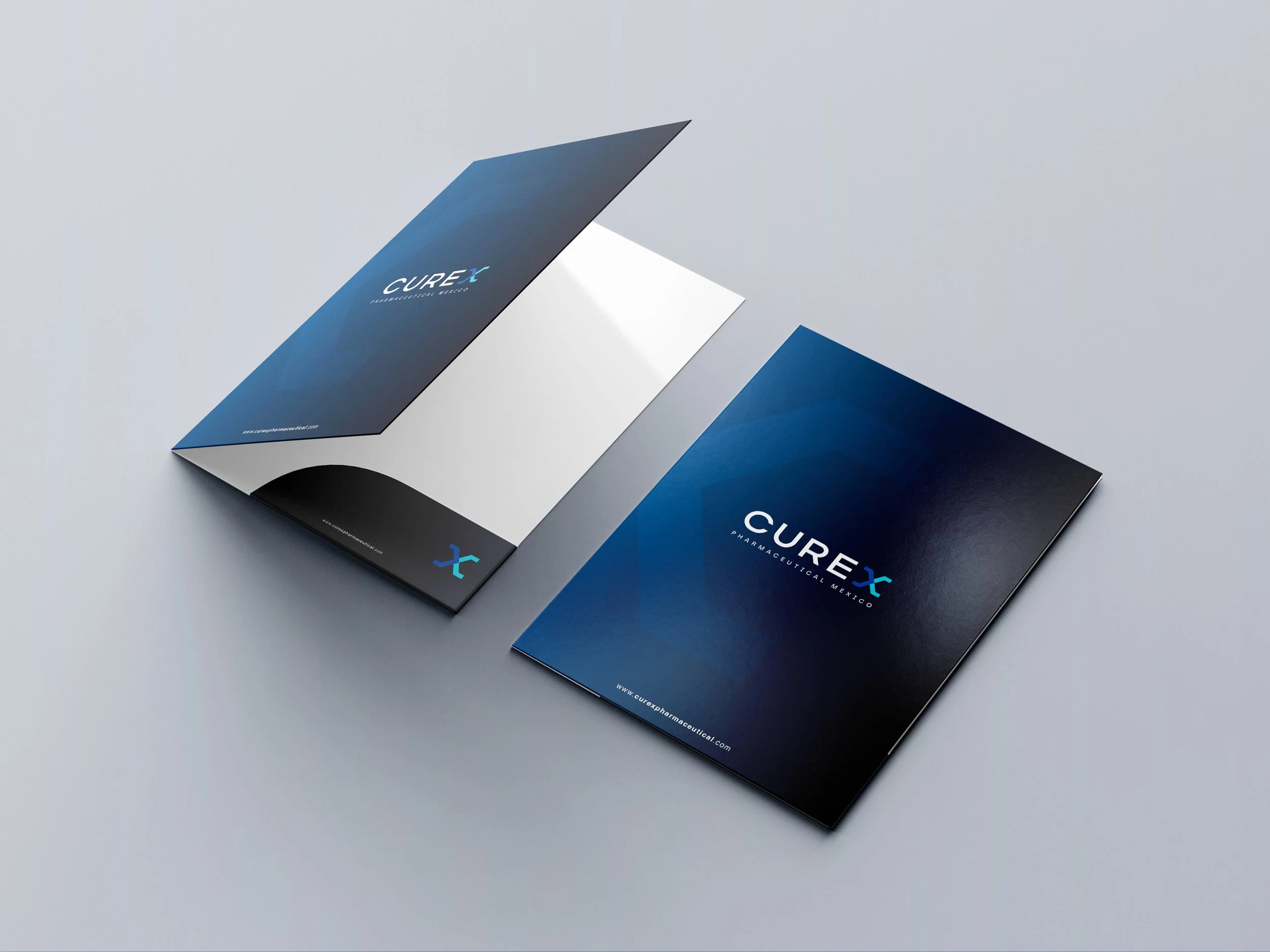 Folded dark blue brochure for CUREX pharmaceutical company on gray surface.