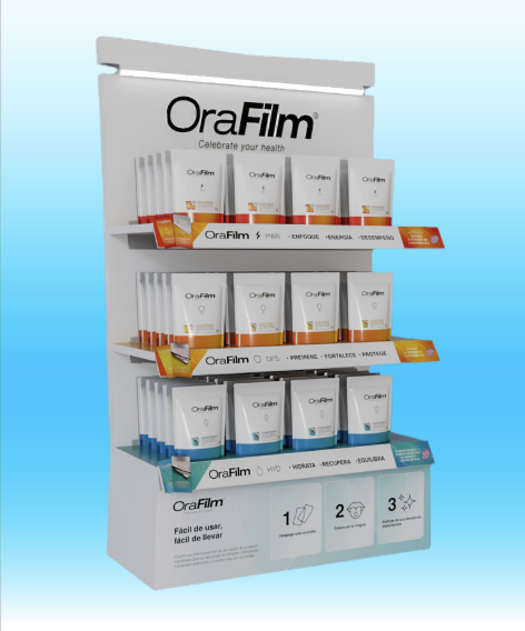 Product display shelf featuring OraFilm health supplements in various packaging colors, with branding and usage instructions.