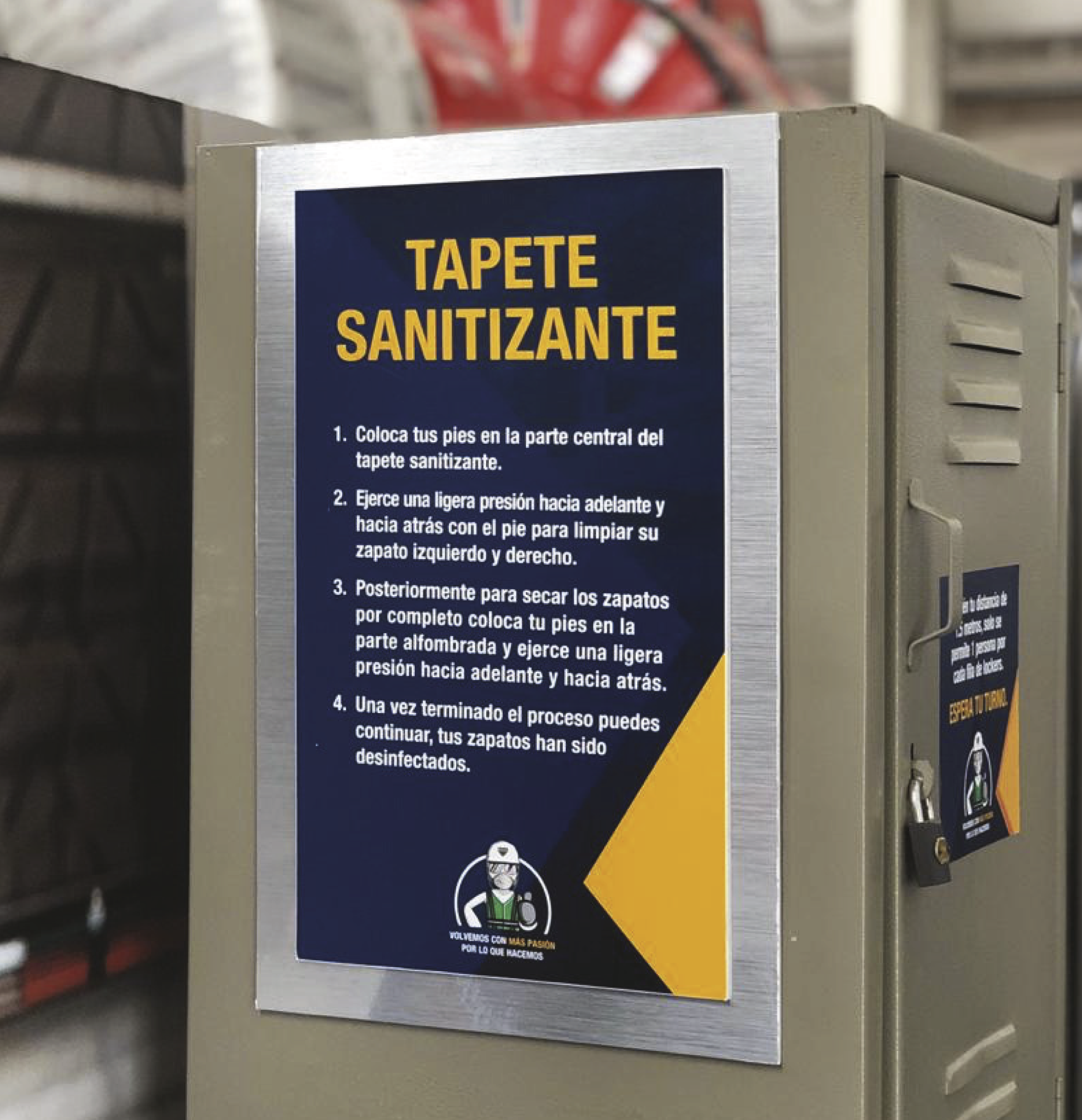 Instructions for sanitizing shoes on a sign attached to a shoe sanitizing mat with a logo at the bottom.