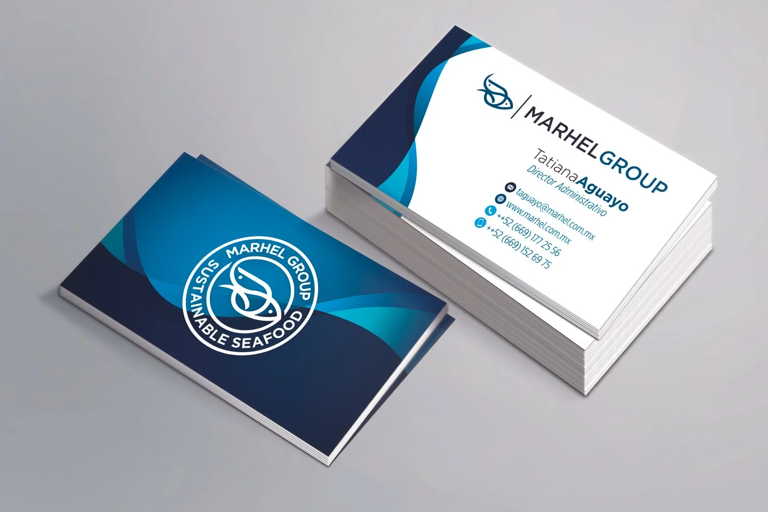 Stack of business cards for Marhel Group, a sustainable seafood company, with a blue and white logo and contact information for Tatiana Aguayo.