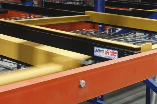 Close-up of a colored pushback cart in the rack.