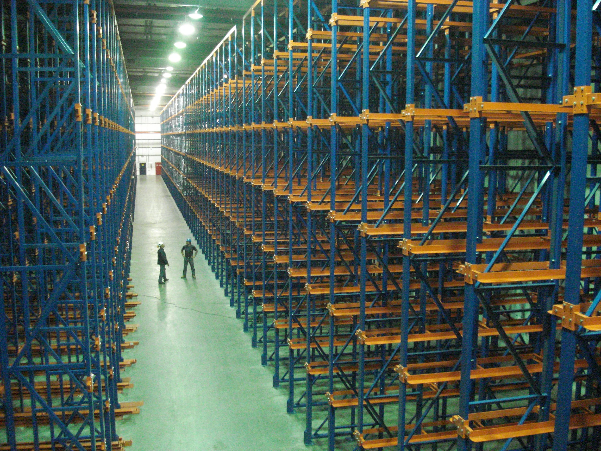 A large warehouse with drive in racking.
