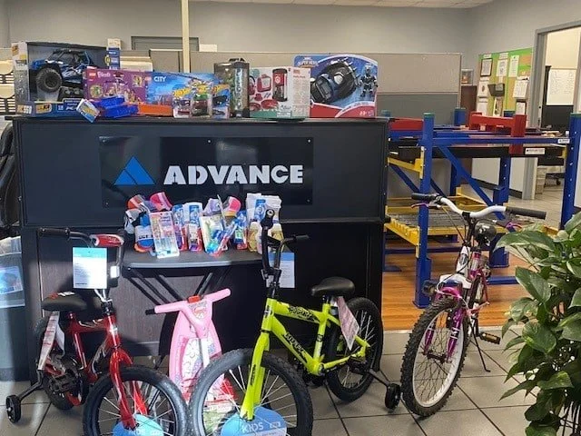 Display of children's bicycles and toys at a retail store.