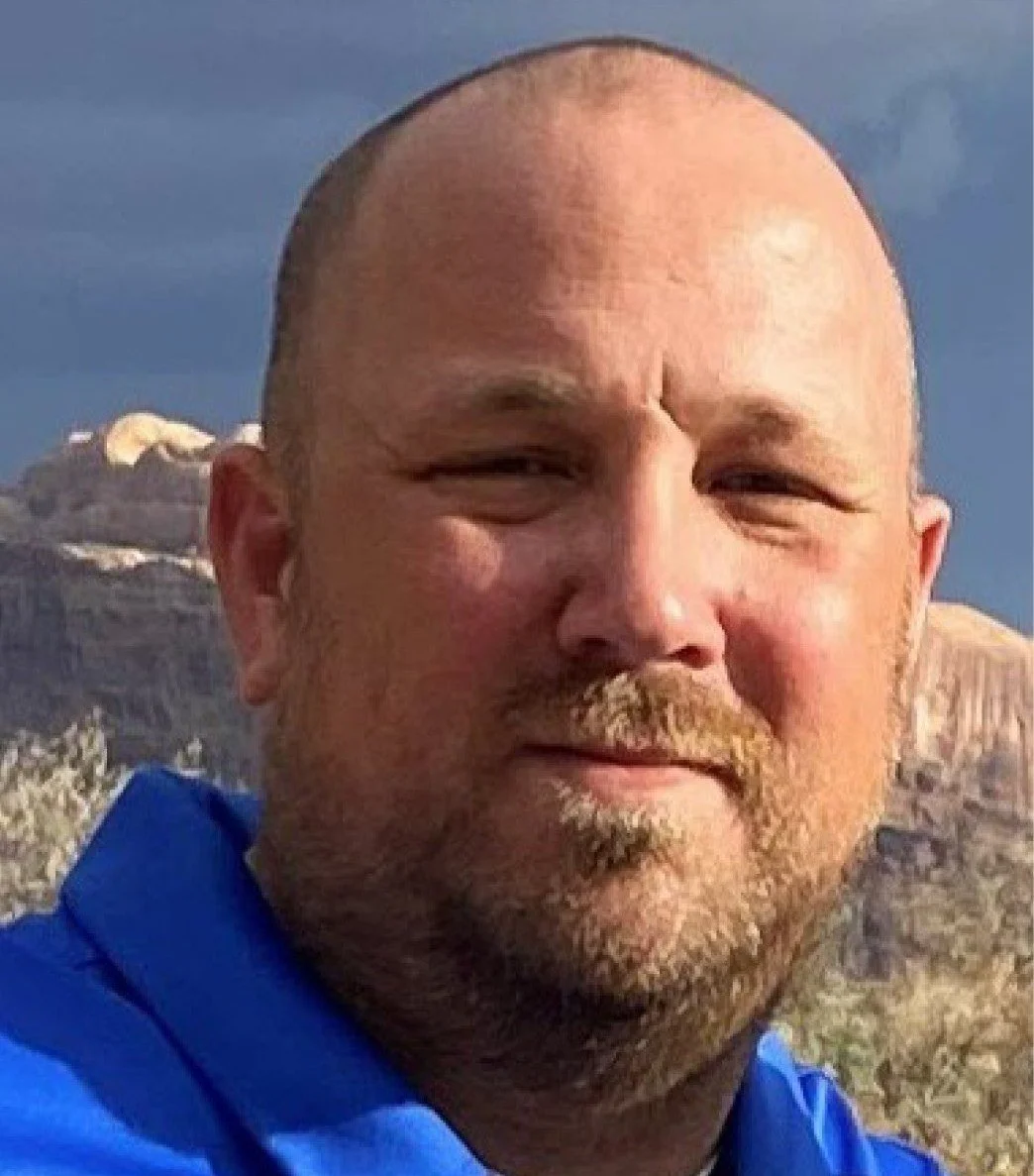 Headshot of Brett Kelly.