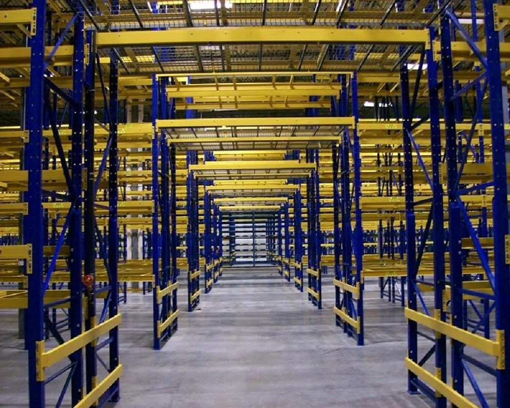 A view down a long pick tunnel through yellow shelves.