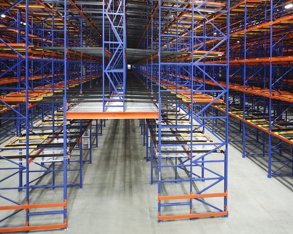 Empty warehouse storage racks showing a pick tunnel from above.
