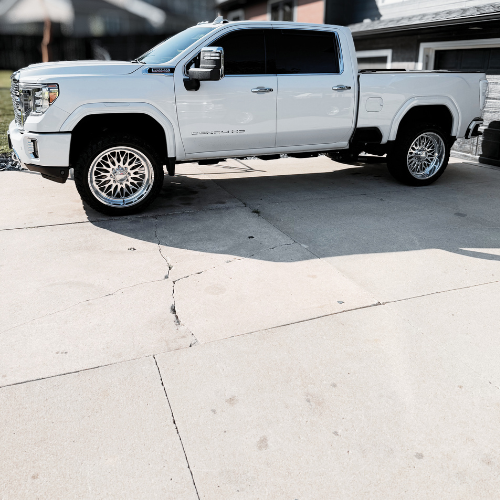 GMC Denali with 24-inch Fuel wheels and 2-inch leveling kit installed by Pence Motorsports