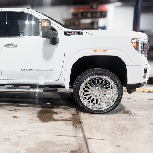 GMC Denali with leveling kit, Fox shocks, American Force wheels, and Falken tires installed by Pence Motorsports