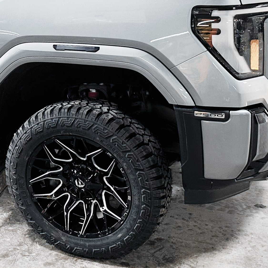 Close-up of GMC 2500 with 20-inch Fuel wheels installed by Pence Motorsports