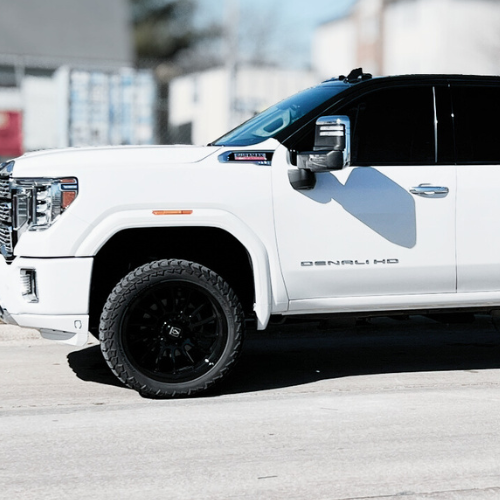 GMC Denali with black wrap and 22-inch Axe wheels installed by Pence Motorsports