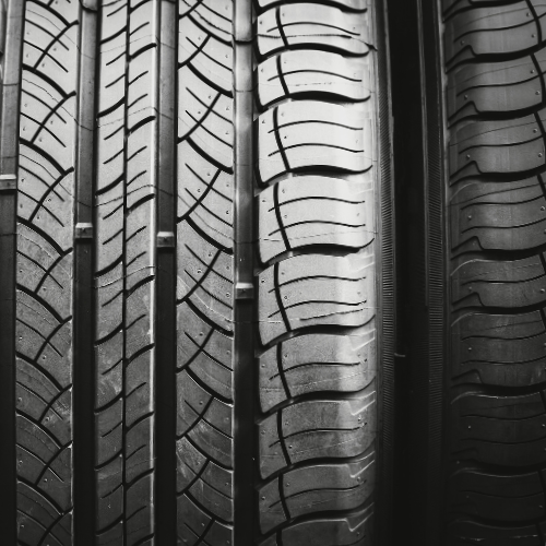 Close-up of tire tread detail showcasing traction and performance installed by Pence Motorsports