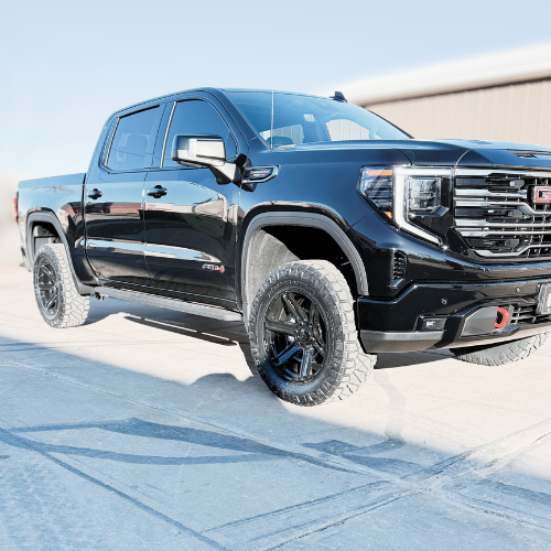 GMC truck with Rough Country leveling kit and 22-inch Fuel wheels installed by Pence Motorsports